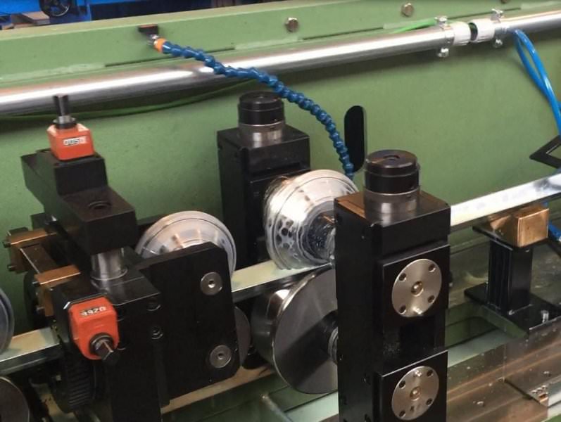 Detail of rollers operating on galvanised sheet strip profiling line